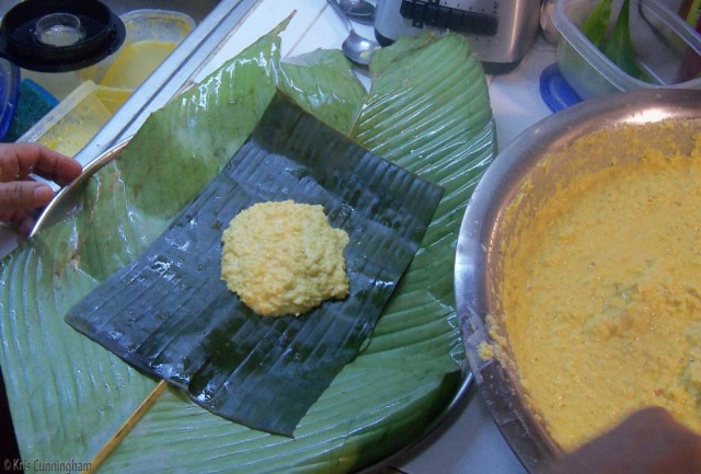 A veehow leaf, a rectangle of plantain leaf, and the tamale filling
